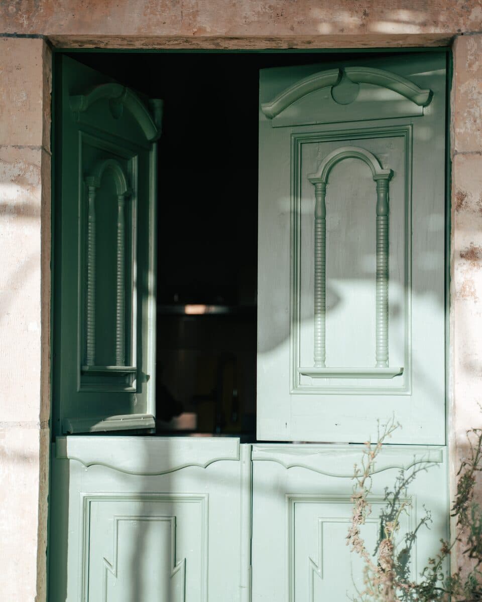 The old green half-door of the taverna